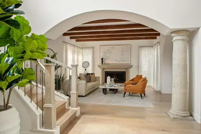 a living room with an archway and a couch and chair at 3BR La Jolla Village Walk to Beach in San Diego