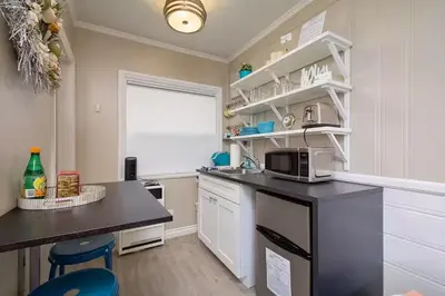 a kitchen with a counter top and a microwave at Steps to Newport Harbor Balboa Fun Zone Dock Access Edgewater Studios in Newport Beach