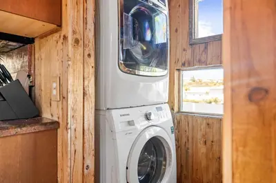 a washer and dryer in a tiny house at Stunning Bay Views with Pickleball and Hot Tub in San Diego