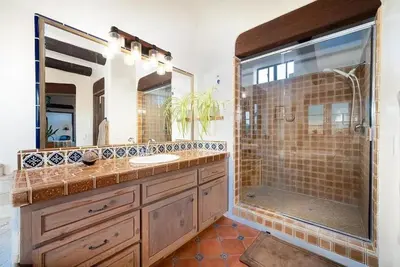 a bathroom with a double sink and a shower at Luxury 5 bedroom Wine Retreat Fallbrook Villa sleeps 12 in Fallbrook
