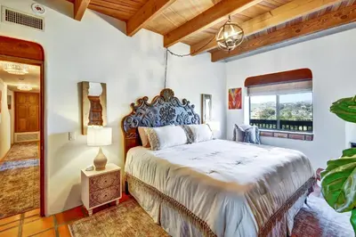 a bedroom with a large bed and a window at Luxury 5 bedroom Wine Retreat Fallbrook Villa sleeps 12 in Fallbrook