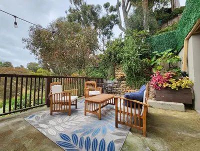 a patio with chairs and a table on a deck at Urban Oasis Near Downtown & Balboa Park in San Diego