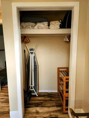 a room with a closet with shelves and wooden floors at Urban Oasis Near Downtown & Balboa Park in San Diego