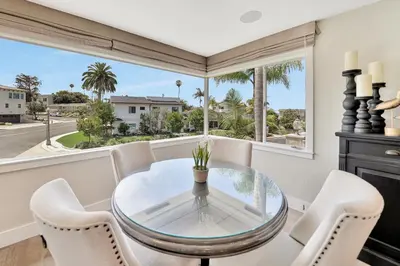 a dining room with a glass table and chairs at Monthly 4BD4BA LuxuryHot TubPool TableYard in San Clemente