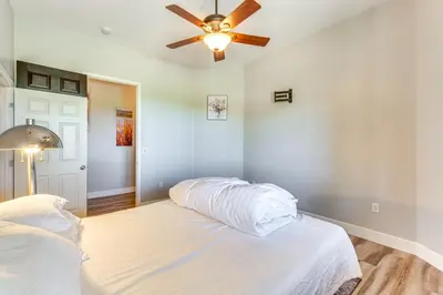 a bedroom with a bed with a ceiling fan at Family Hideaway with Hillside Views in Temecula! in Temecula