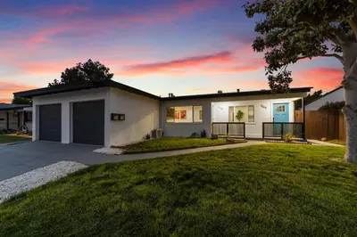 a large white house with a grass yard at NEW 2BR, 1BA, Outdoor Fireplace, Patio Lounge, Western Vibes, Smart TVs, Ambient Lighting in San Diego