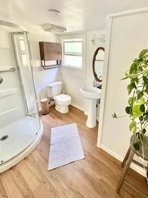a bathroom with a shower and a toilet and a sink at Casa Sol in San Diego