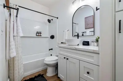 a white bathroom with a sink and a toilet at Luxury Escondido Family Oasis with Hot Tub in Escondido