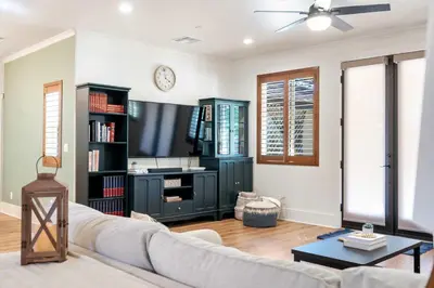 a living room with a couch and a tv at Luxury Escondido Family Oasis with Hot Tub in Escondido