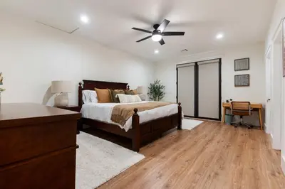 a bedroom with a bed and a ceiling fan at Luxury Escondido Family Oasis with Hot Tub in Escondido