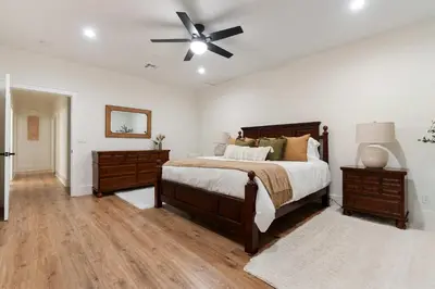 a bedroom with a bed and a ceiling fan at Luxury Escondido Family Oasis with Hot Tub in Escondido