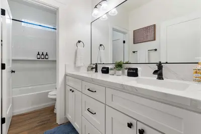 a white bathroom with a sink and a tub at Luxury Escondido Family Oasis with Hot Tub in Escondido