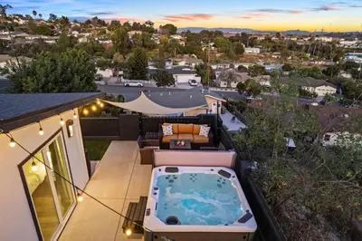 a hot tub on the balcony of a house at Dog-Friendly House with Hot Tub, AC, Game Room in Oceanside