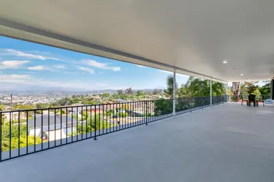 an empty balcony with a view of the city at Sleeps 31 10br Mountain View, Pool, Spa and Games in El Cajon
