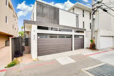 an image of a garage door in a house at Beachfront Bliss Cozy 1BR Condo with Shared Perks in San Diego