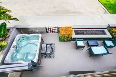 an aerial view of a bath tub and a table and chairs at Beachfront Bliss Cozy 1BR Condo with Shared Perks in San Diego