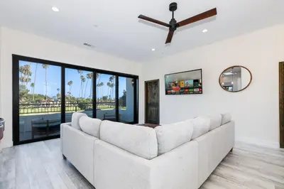 a living room with a couch and a ceiling fan at Inviting 3BR Space with Firepit in San Clemente