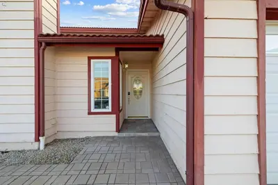 a hallway of a house with a red door at Spacious 4BR Oasis with Pool Table and Spa in San Diego