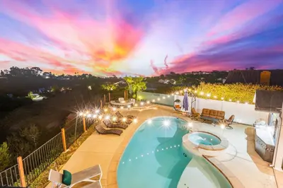 a swimming pool on top of a house with a sunset at Modern La Jolla Escape Pool Rooftop Views in San Diego