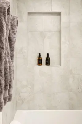 two bottles of soap are sitting on a shelf in a bathroom at Casa Ciela, AC,Spa,15 min Downtown, Beach, Theatre in San Diego