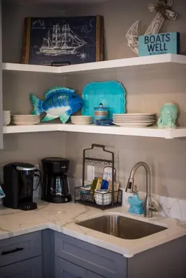 a kitchen counter with a sink and a fish on a shelf at #753Coastal Anchor Suite!GroundLevel/Parking/Grill in San Diego