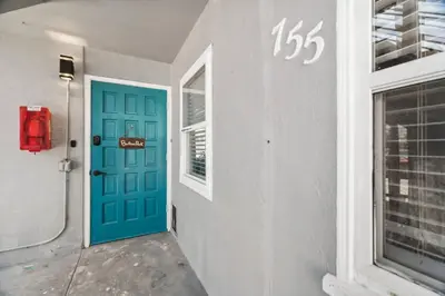 a blue door in a building with a window at #755 2B2B Beach Getaway!Ground Level w/Patio&Grill in San Diego