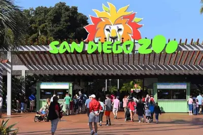 a crowd of people walking in front of a san diego zoo sign at #755 2B2B Beach Getaway!Ground Level w/Patio&Grill in San Diego