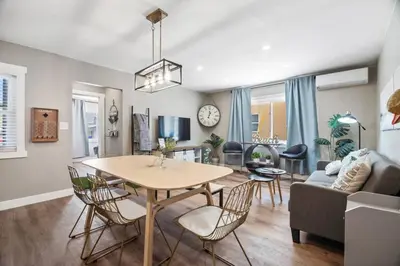 a dining room and living room with a table and chairs at #755 2B2B Beach Getaway!Ground Level w/Patio&Grill in San Diego