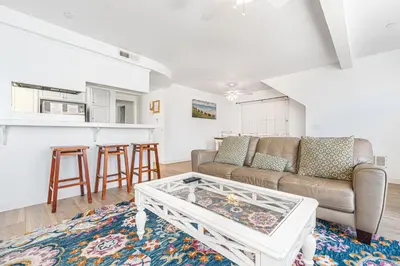 a living room with a couch and a table at 3Br Oceanview Corner Retreat One House From The Beach By Beachview Rentals in Newport Beach