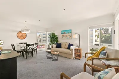 a living room with a couch and a table at Seize the Day in San Diego