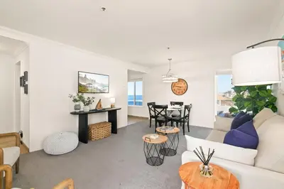 a living room with a couch and a table at Seize the Day in San Diego
