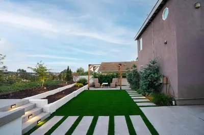a garden with a lawn and a house at Chic Retreat Ping Pong, Bonfires and Patio Leisure in San Diego