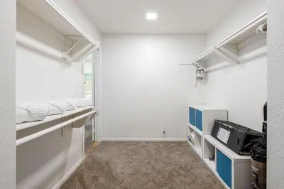 an empty room with white walls and white shelves at Steps From the Beach & Belmont in San Diego