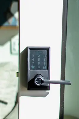 a safe is attached to a white wall at Ocean View Loft in Little Italy near Downtown-Gaslamp in San Diego