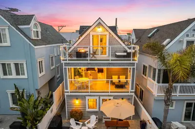 an aerial view of a house with an umbrella at Ocean Breeze and Rooftop Views Steps to Surf and Sun in San Diego