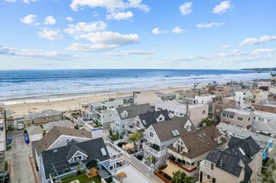 an aerial view of the beach and buildings at Ocean Breeze and Rooftop Views Steps to Surf and Sun in San Diego