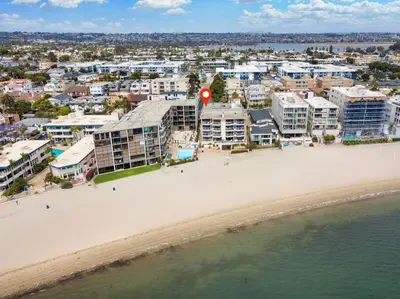 an aerial view of the beach and buildings at Crown Point 3BR Bay and Beach View Parking W D in San Diego