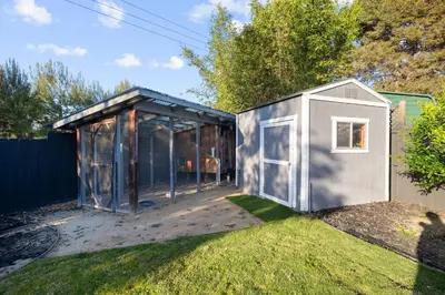 a small shed with a door in a yard at Modern Oceanside Stay with Yard & Laidback Vibes in Oceanside