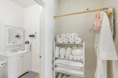 a bathroom with a towel rack with towels at Golden Hill Gem 2 Mi to Gaslamp Quarter - Dogs OK! in San Diego