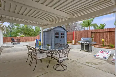 a patio with a table and chairs and a grill at Explore Ramonas Vineyards Tranquil Home with Yard in Ramona
