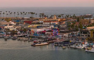 an aerial view of a harbor with boats in the water at Family Beach House Steps From Sand W Oceanview Patio By Beachview Rentals in Newport Beach