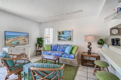 a living room with a couch and a table at Family Beach House Steps From Sand W Oceanview Patio By Beachview Rentals in Newport Beach