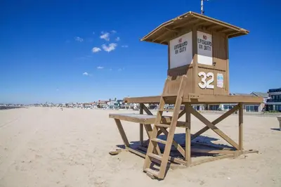 a life guard stand on the beach at Family Beach House Steps From Sand W Oceanview Patio By Beachview Rentals in Newport Beach