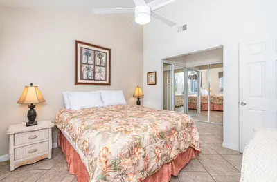a bedroom with a bed and a ceiling fan at Retro 3Br Split-Level W Oceanview Patio Steps To Sand By Beachview Rentals in Newport Beach