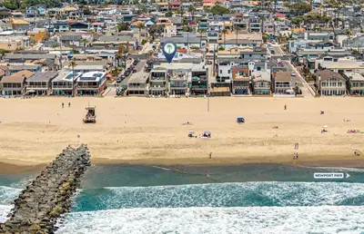 an aerial view of a beach with a city at 4Br Coastal Retreat Seconds From Popular 40Th Street Beach By Beachview Rentals in Newport Beach