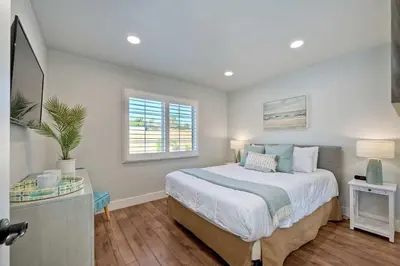 a bedroom with a large bed and a window at Immaculate 3 BDR in Oceanside - Private Pool & Spa in Oceanside