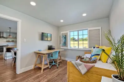 a living room with a couch and a table at Immaculate 3 BDR in Oceanside - Private Pool & Spa in Oceanside