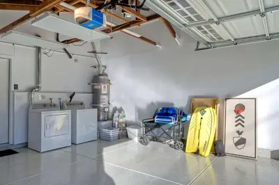 a laundry room with washers and dryers in a building at Immaculate 3 BDR in Oceanside - Private Pool & Spa in Oceanside