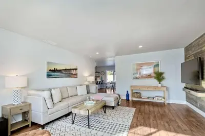 a living room with a couch and a tv at Immaculate 3 BDR in Oceanside - Private Pool & Spa in Oceanside