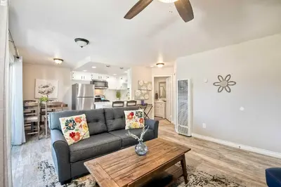 a living room with a couch and a table at Silver Surf Getaway in Oceanside